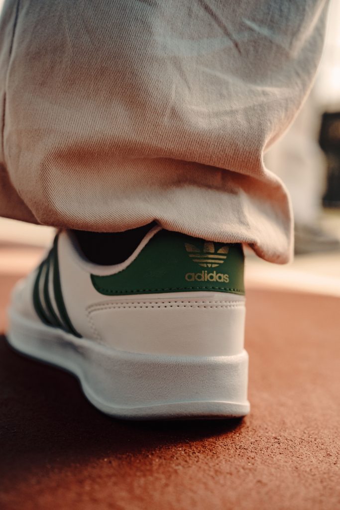 Stylish Adidas sneaker captured outdoors with a focus on footwear fashion.